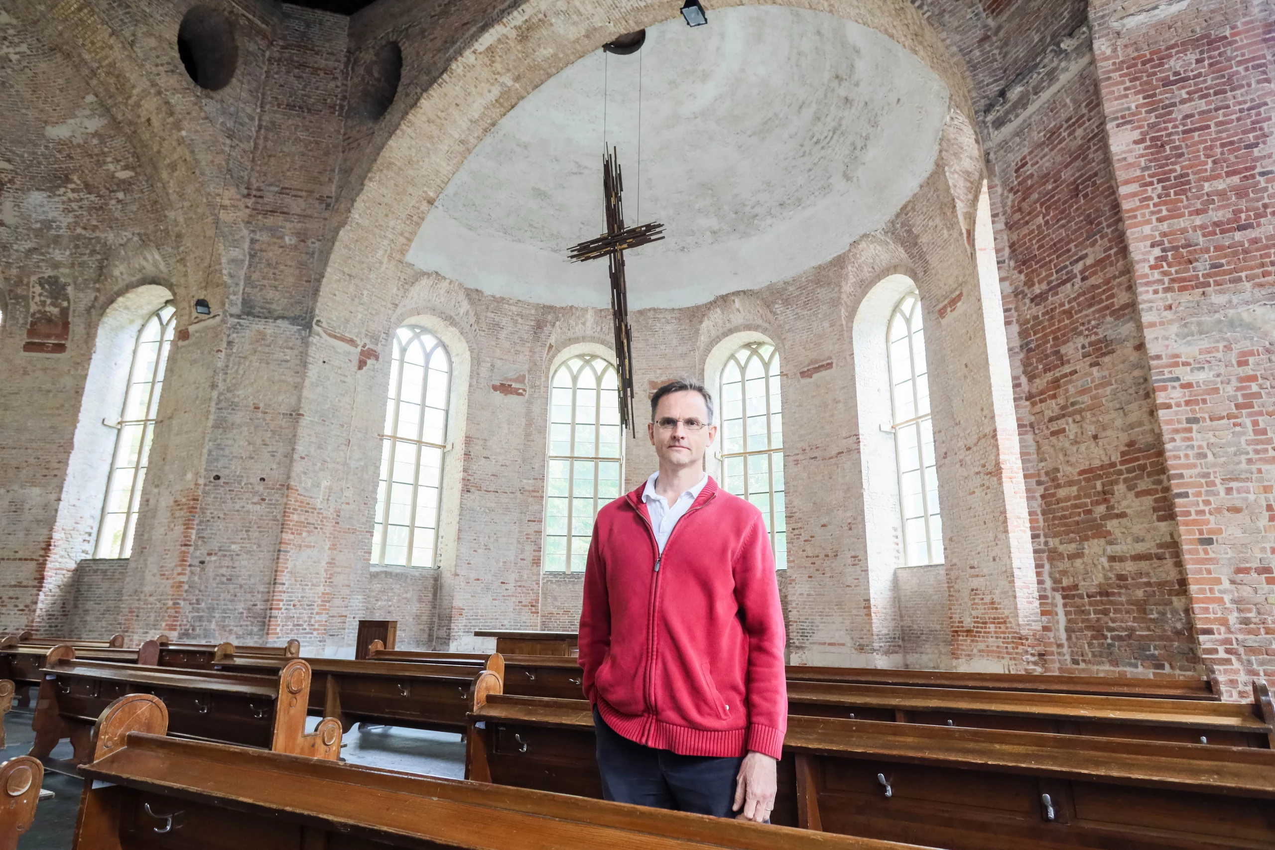 Religious freedom prevails. David Byle stands in a church in Germany after facing religious persecution in Türkiye.
