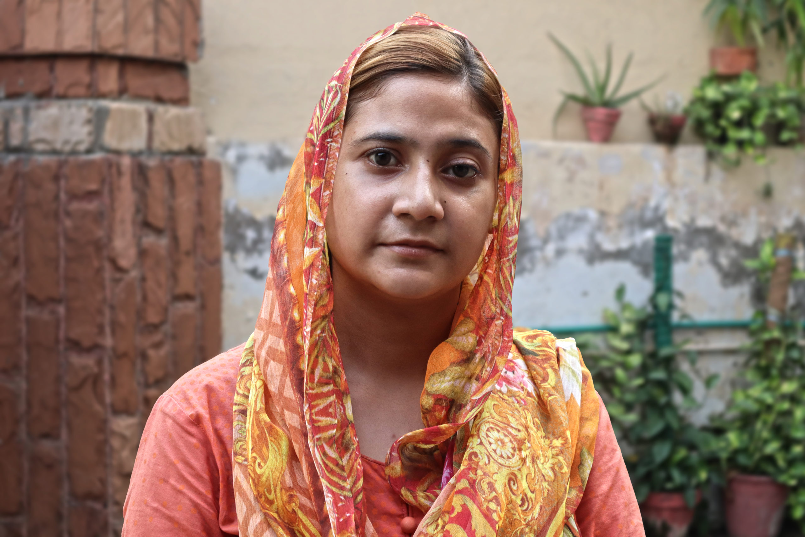 Reeha wearing orange