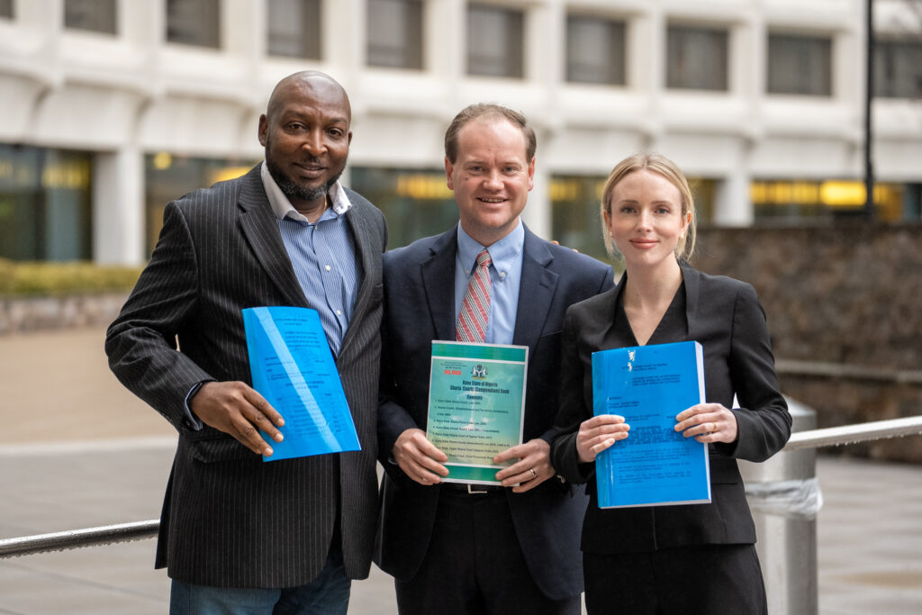 Kola Alipinni, Yahaya's lawyer standing with Sean Nelson and Kelsey Zorzi