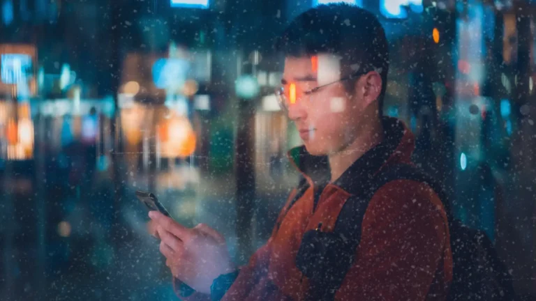 Man on his phone in a digital realm design