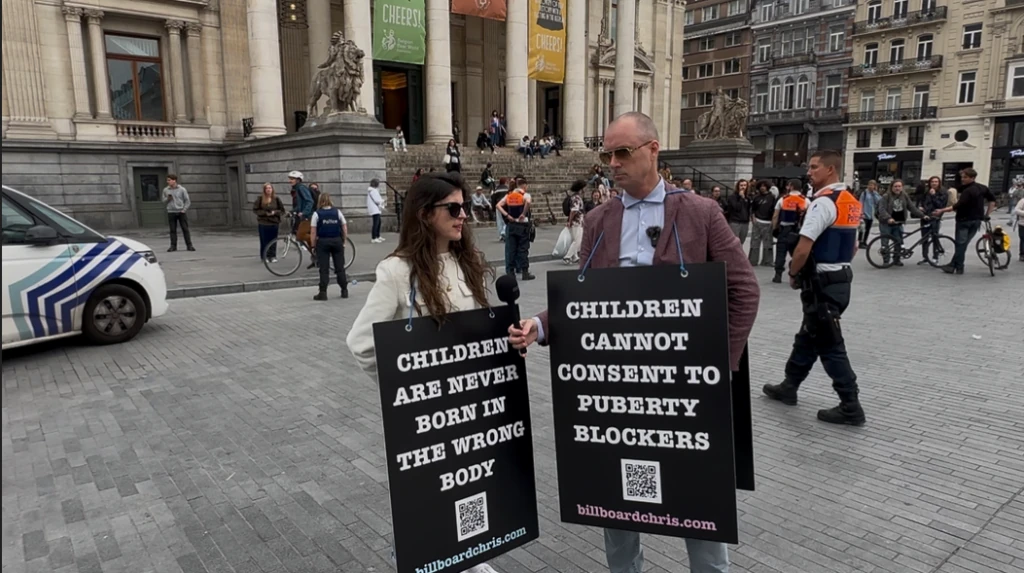 Police arrest ADF International team member and Canadian child protection advocate Billboard Chris for their signs, while ignoring violent counter-protestors