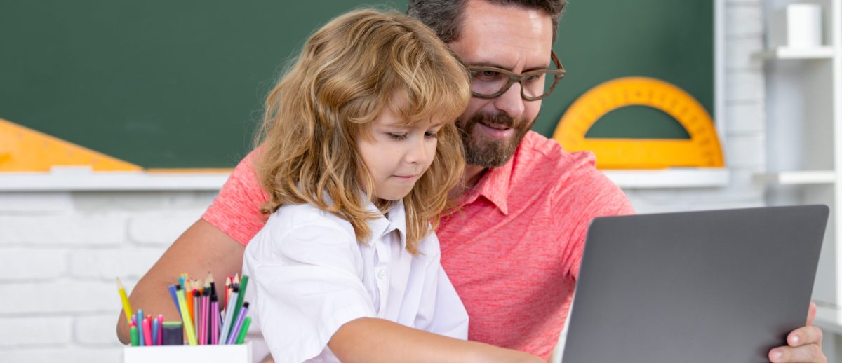 School Teacher And Child Pupil Learning At Laptop Computer, Stud